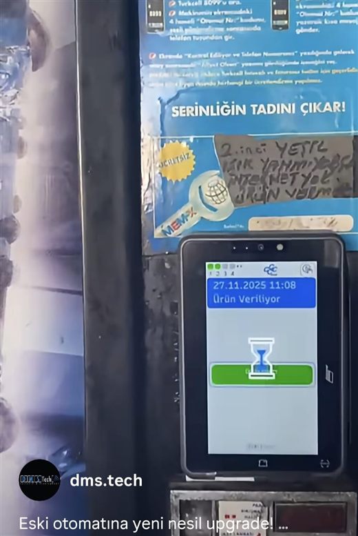 November 2025: the 1990s Dixie Narco brought onto the new device — with the 2003 poster for the phone service still hanging above it